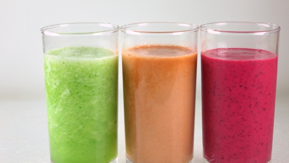 Three Glasses Of Multicolored Vegetable Smoothies