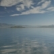 The Lake View With Small Waves And Islands, Hills And Cloudy Sky On The Background.  - VideoHive Item for Sale