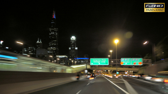 Driving at Full Speed to Downtown Chicago at Night