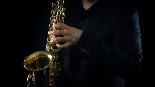 Man Plays The Saxophone On Stage