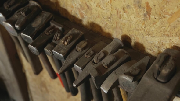 Hand Tool For Metal Forging Hangs On Wall .