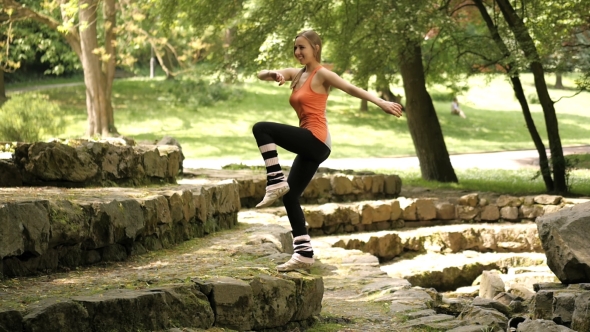 Attractive Young Girl Exercise In The Park