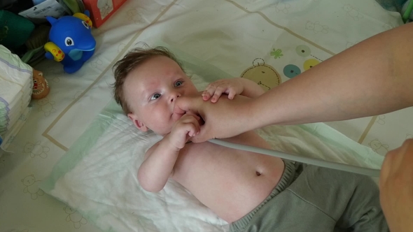 Pediatrician Examining Baby Boy