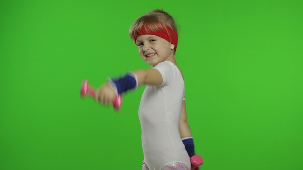 Caucasian Girl in Sportswear Making Exercises with Dumbbells, Workout for Kids, Athletic Child