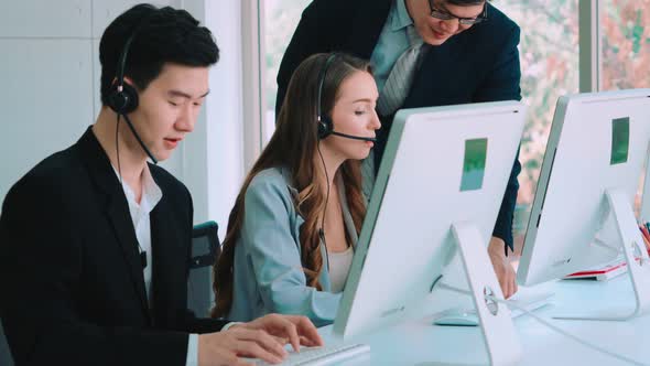 Business People Wearing Headset Working in Office