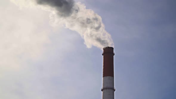 Pipes with smoke: industrial production, plant, air pollution.