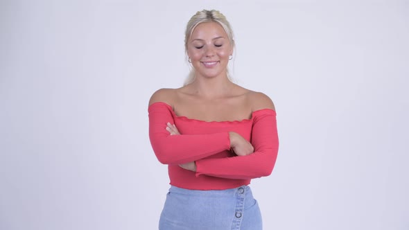 Happy Young Beautiful Blonde Woman with Arms Crossed
