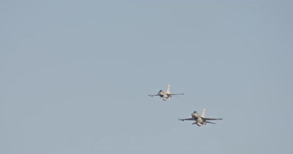 F-16 falcon fighters flying at high speed at low altitude