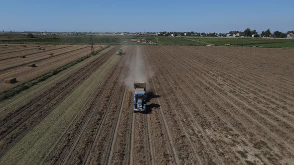 The Tractor Harvesting Peanuts Works in the Wide Field