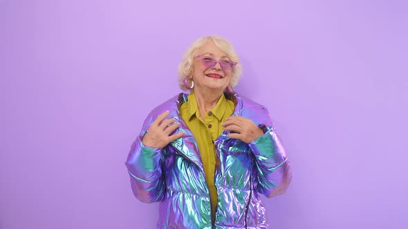 Happy Elderly Woman Happy with Herself Posing Smiling for the Camera, Isolated Background