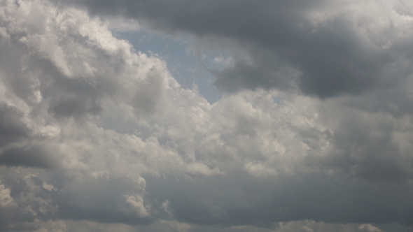 Fast moving clouds on blue sky