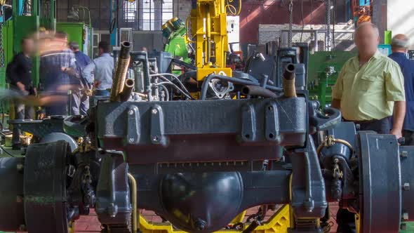 Conveyor Assembly Stage the Body of Tractor at Big Industrial Factory Timelapse