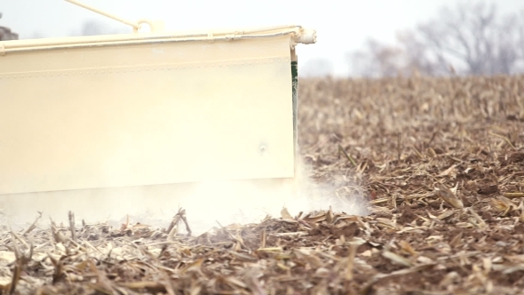 Farmer Is Fertilize Corn Field. Farming Background.