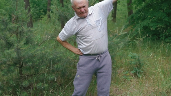 Old Man Does Morning Body Incline With Up Hand