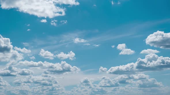 Clouds Float Across the Blue Sky in Shuttles Shape Timelapse