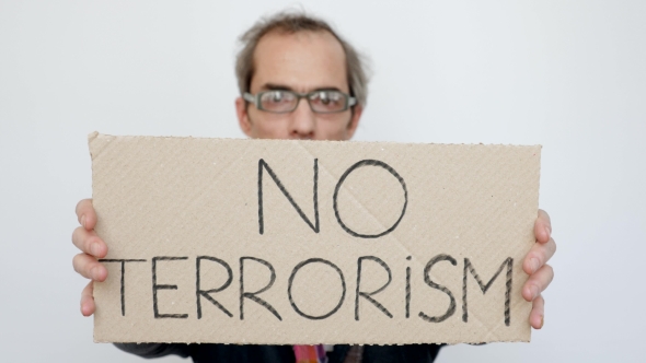 Man Showing No Terrorism Tablet
