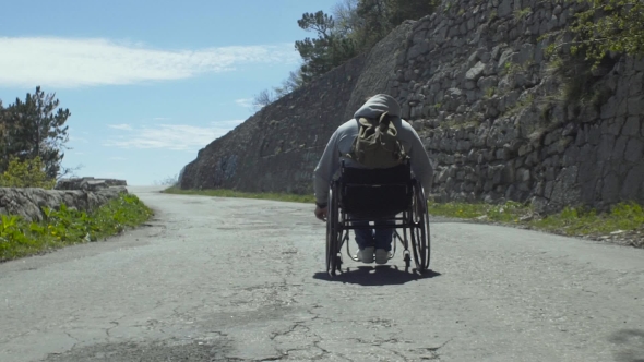 Handicapped Man On Mountain Pathway