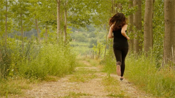 Girl Running In The Wild Forest