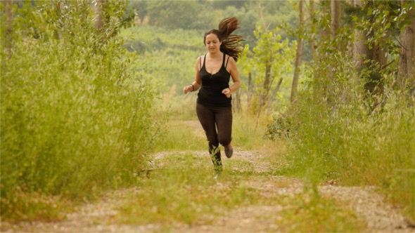 Girl Running In Forest