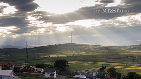 Sun Rays Over the Green Hill