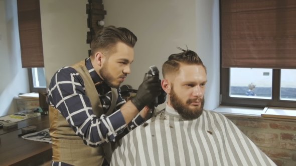 Men's Hairstyling And Haircutting With Hair Clipper In a Barber Shop Or Hair Salon