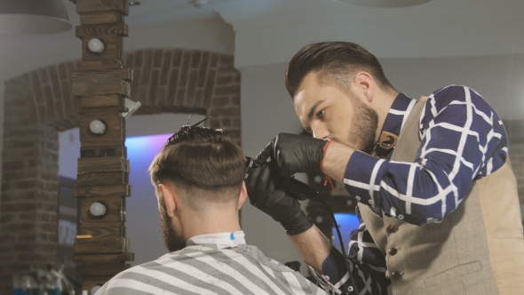 Men's Hairstyling And Haircutting With Hair Clipper In a Barber Shop Or Hair Salon