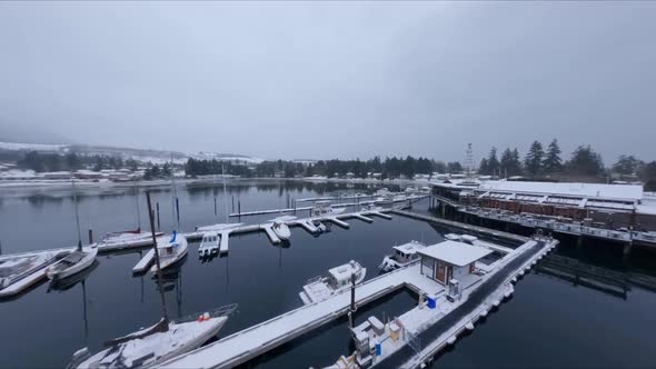 Overview Towards the Shores of a Snow-Covered Marina in Sechelt Inlet British Columbia Canada - Forw