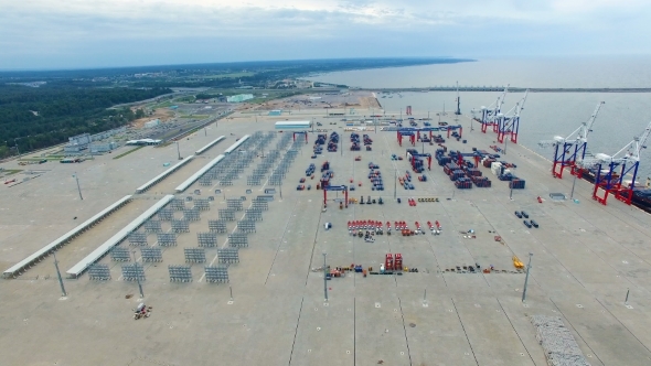 Aerial view of a seaport with cranes, ships, containers and cargo in Saint-Petersburg, Russia