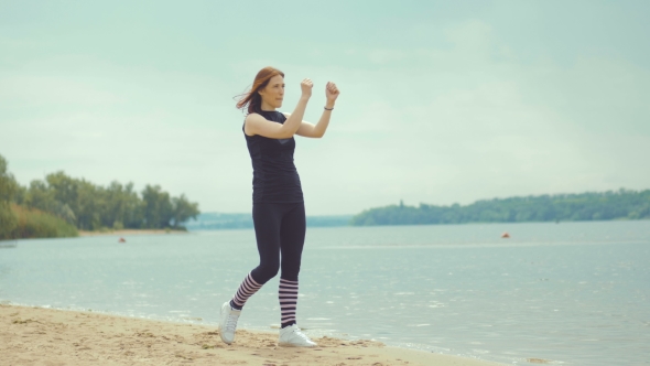 Beautiful Red-haired Girl Doing Exercises