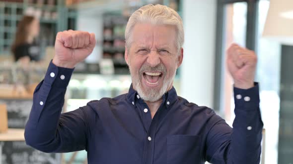 Excited Old Man Celebrating Success