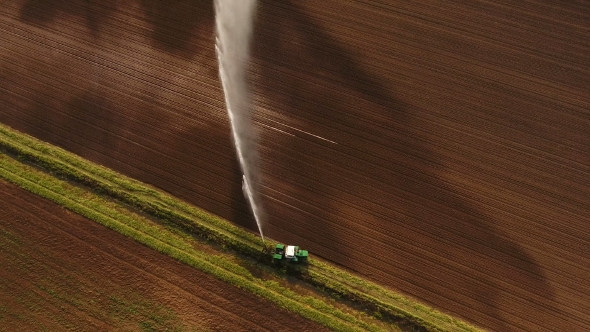 Aerial view:Irrigation System Watering a Farm Field