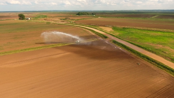 Aerial view:Irrigation System Watering a Farm Field.