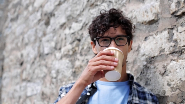 Man In Eyeglasses Drinking Coffee On Street 21