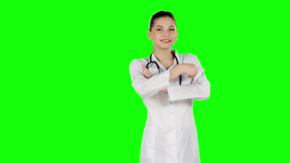 Female Doctor Smiling To Camera. Green Screen