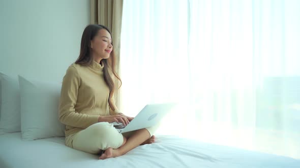 Young asian woman use laptop