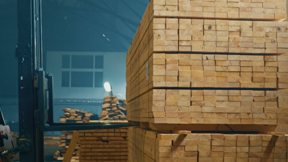 Trucks Transporting Blocks Of Wood