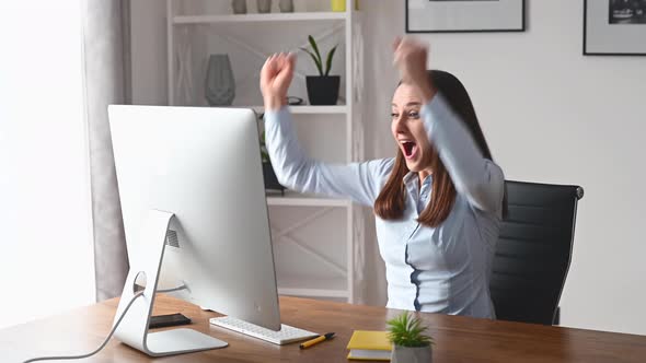 A Young Woman Is Using PC in the Office