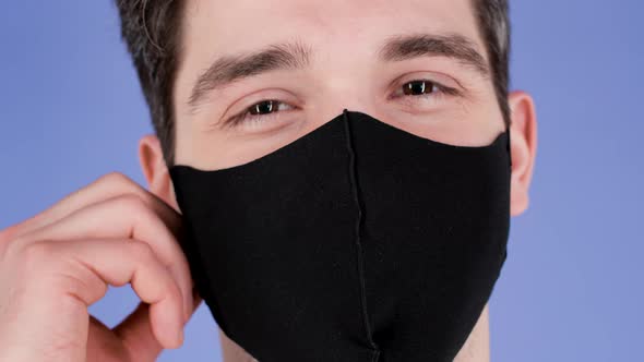 Pleased Man Removed Protective Facial Black Mask As Symbol of Pandemic Epidemic End