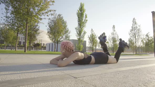 Beautiful Young Woman On Rollerblading In Park At Sunrise