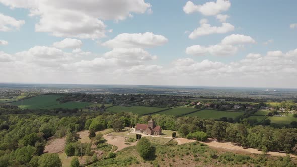 Aerial drone shot of church in countryside track back