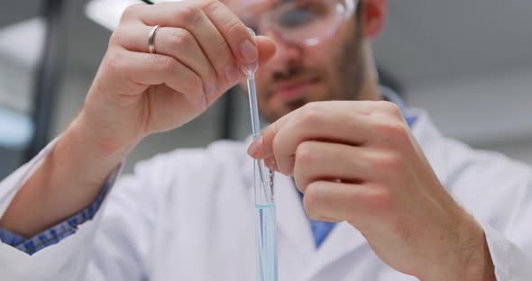 Scientist Taking Samples From Tubes in the Laboratory Uses Petri Dish