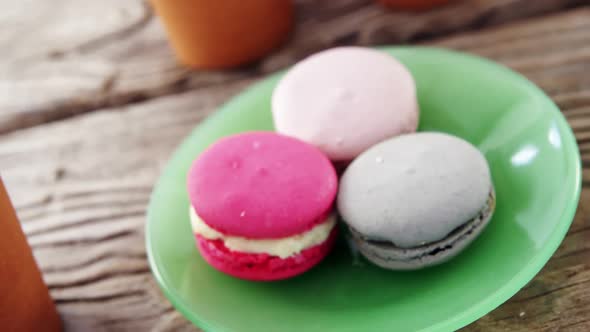 Colorful macaroon cookies in plate