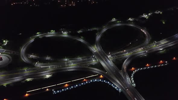 Drone shop over a heart shaped bridge in Taiwan with train passing through