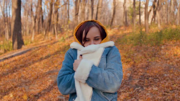 Young Frozen Woman in Warm Denim Jacket