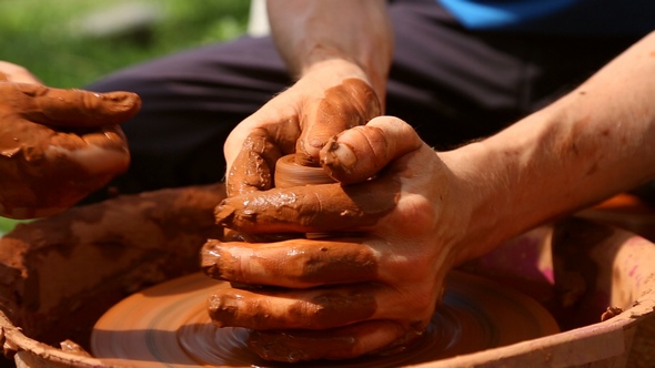 Potter Makes Pottery Clay on a Potter's Wheel