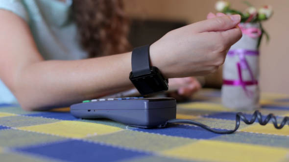 Girl Was Paying Using a Smart Watch in a Cafe