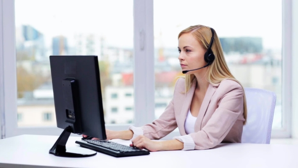 Businesswoman With Computer And Headset Talking 25