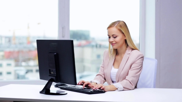 Young Businesswoman With Computer Typing At Office 5