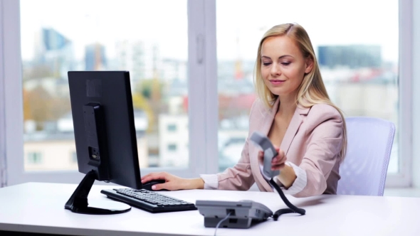 Smiling Businesswoman With Computer And Telephone 14