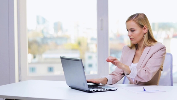 Businesswoman With Laptop And Papers 34